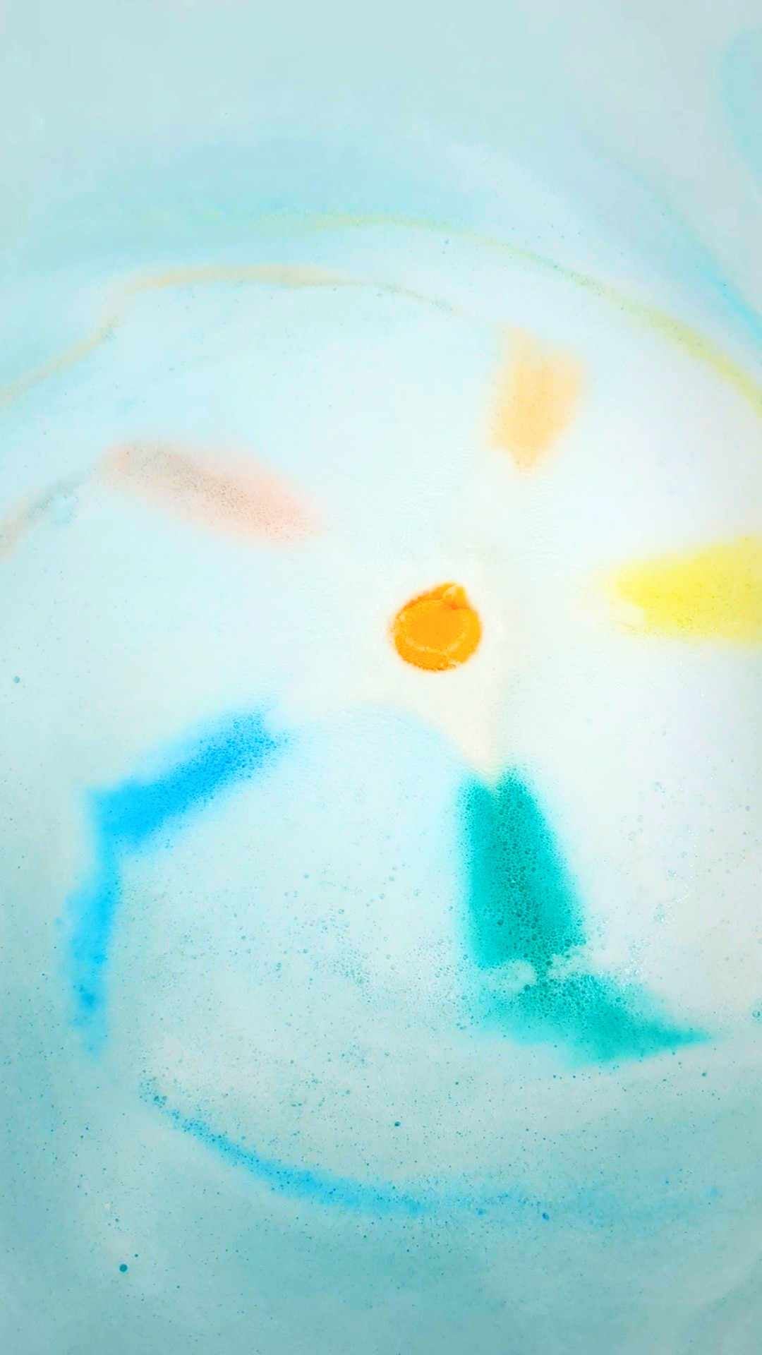 Rainbow Rocket Sprudel fizzing in pale blue bath water