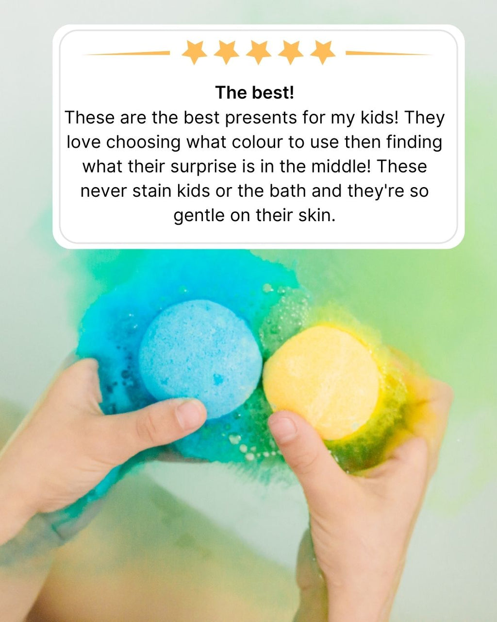 Child's hands holding blue and yellow kids bath bombs beside a five-star review