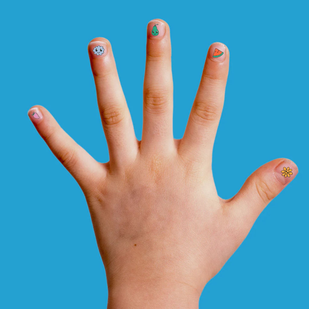 Child's hand with small coloured Buds nail stickers on a blue background